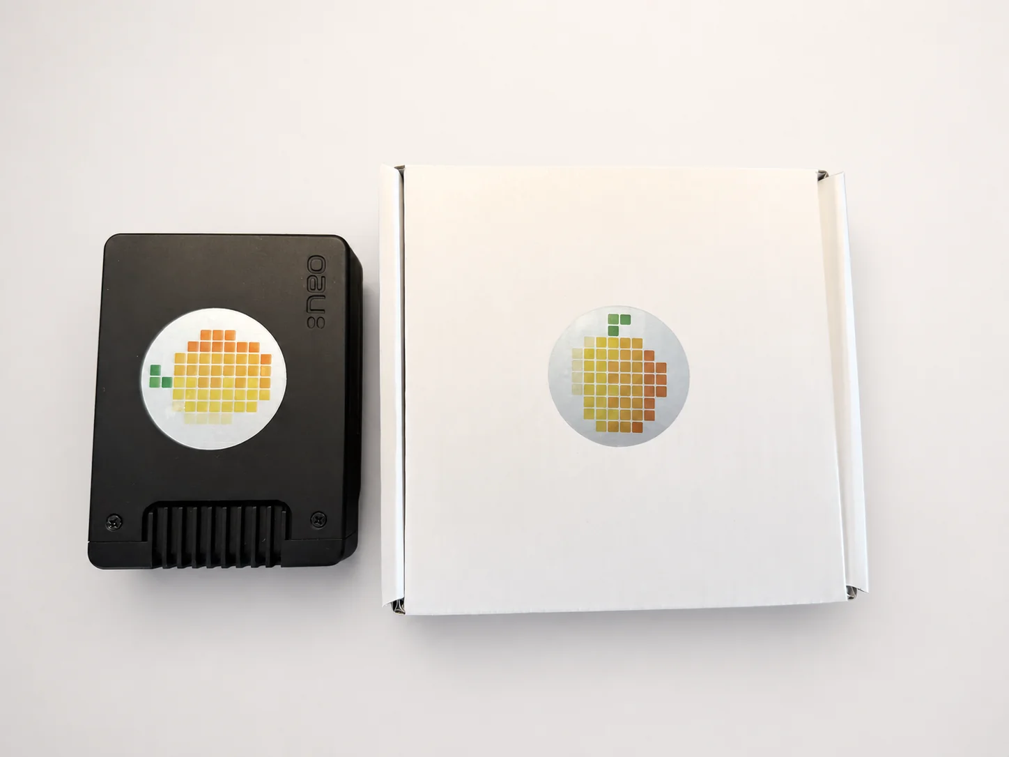 Black MangoTart Agent Computer next to its white retail box